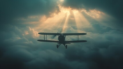 A biplane flies over the clouds at sunset.