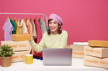 Young asian woman running online store purchase shopping order and box packaging on table Startup small business SME.