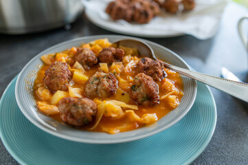Cabbage soup with fried meatballs 