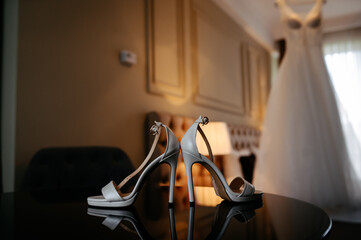 bride shoes on black table