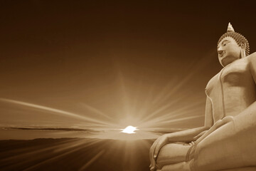 Sepia Image of Seated Buddha Image with Fantastic Sunbeams Radiating above Clouded Ocean in the...