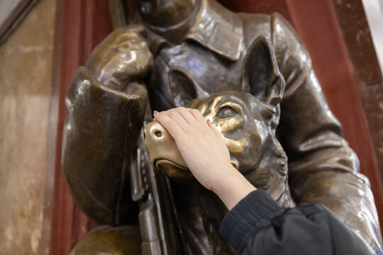 View of the Hand Rubbing Famous Statue of a Bronze Dog Nose for Good Luck in Ploshchad Revolyutsii Underground Station