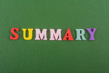 SUMMARY word on green background composed from colorful abc alphabet block wooden letters, copy...