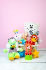 Collection of colorful toys on a pink background. Kids toys.
