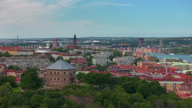 Scenic aerial view of the Old Town with Oscar Fredrik Church in the gorgeous sunset, Gothenburg, Sweden. rooftops panoramic view, Klippan port in Gothenburg harbor in afternoon, Famous bridge 