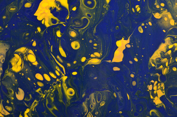 abstract art background in dark yellow and blue colors with cells and splashes
