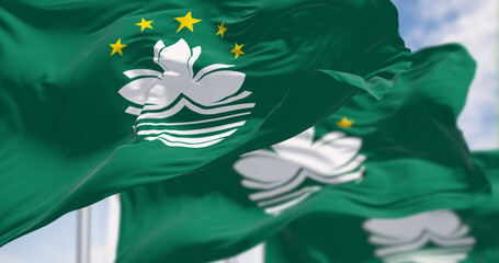 Close-up of Macau flags waving on a clear day - 793028327