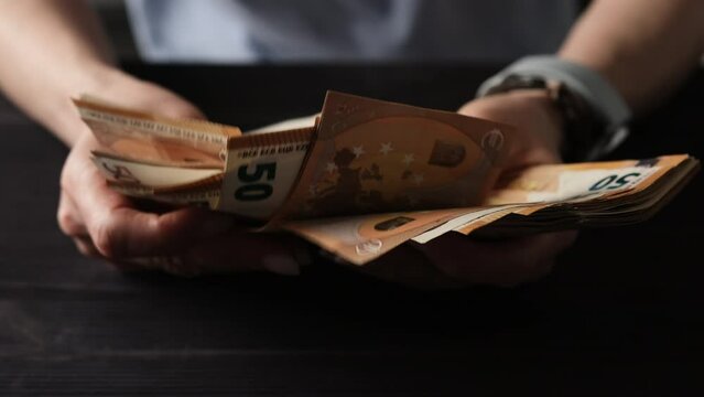 Slow Motion Of Female Hands Counting Fifty Euro Bills