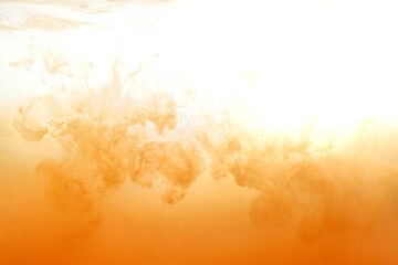 Orange color dye melt on white background,Abstract smoke pattern,Colored liquid dye,Splash paint