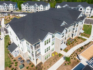 Drone Images of New Residential Apartment Buildings Featuring Architectural Asphalt Shingles On a Bright Sunny Day  