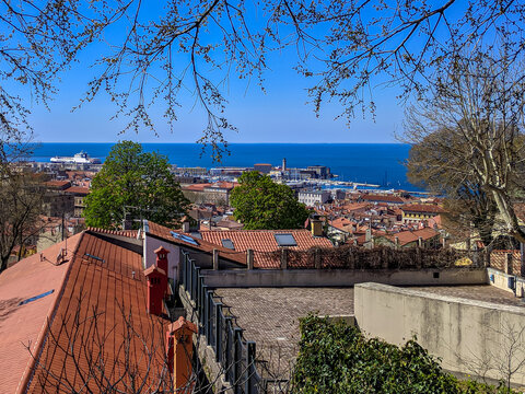 Scenic aerial view seen from the old town center of Muggia near Trieste in Friuli-Venezia Giulia, Italy, Europe. Blue sky in tranquil atmosphere at Adriatic Mediterranean sea in summer. Sightseeing