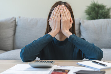 Financial owe asian woman sitting cover face with hands, stressed by calculate expense at home,...