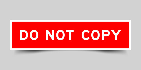 Red color square label sticker with word do not copy that inserted in gray background