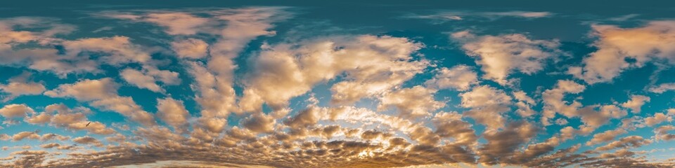 Sunset sky with bright glowing pink Cumulus clouds. Seamless spherical HDR 360 panorama. Full...