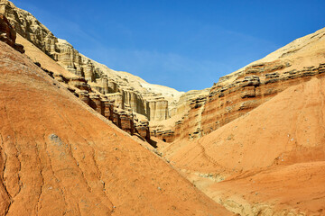 sandstone mountains with visible layers and traces of erosion in Altyn Emel National Park,...