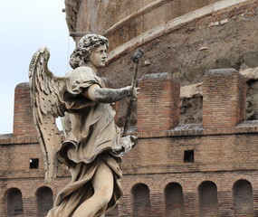 Statue of the Angel with the Sponge with Castel Sant'Angelo in the Background in Rome, Italy