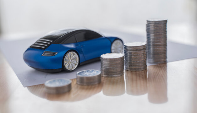 image of a vehicle miniature and several superimposed coins representing an increase