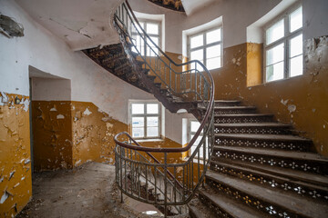 Exploration of the historic old stone mill with a spiral staircase in Southern Poland, Europe, in...
