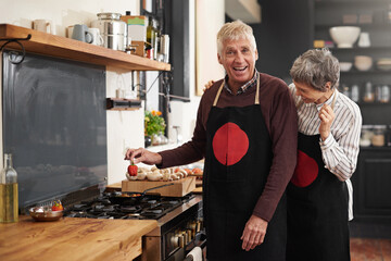 Cooking, portrait and senior couple in kitchen at home with ingredient for health diet meal. Laughing, food and elderly man and woman with funny joke for dinner, lunch or supper with vegetables. - obrazy, fototapety, plakaty