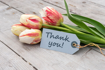 Greeting card with red, yellow and white tulips and english text: Thank you