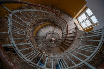 Exploration of the historic old stone mill with a spiral staircase in Southern Poland, Europe, in Winter