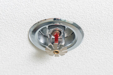 Fire fighting equipment, sprinkler on white ceiling