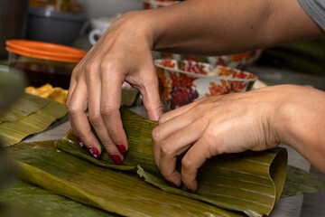 wrap a Hallaca or tamale in banana leaf.