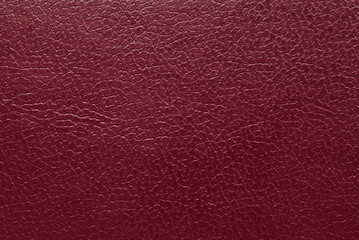 Maroon color leather texture as background