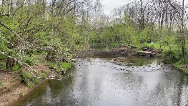West Hickman creek in Veterans Park in Lexington, Kentucky where old, broken dam let water to flow