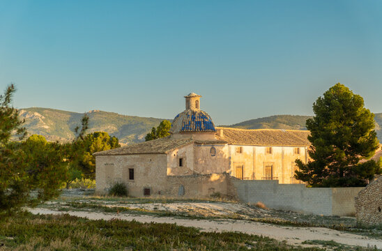 Beautiful abandoned church, with a tiled dome, on a sunny sunset