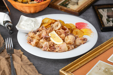 Fried Calamari: Crispy golden rings of calamari, deep-fried to perfection, served with a side of...
