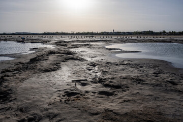 cosmic unreal landscapes of the Baskunchak salt lake on a spring day