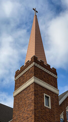 Church Steeple and Cross against Blue Sky