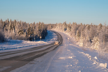 Frozen winter road. Winter landscape with a view of the road.
