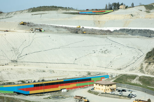Peccioli, Italy-June 8, 2023-Impianto Belvedere', the large imposing waste dump where several trucks unload their waste every day in a remote valley,