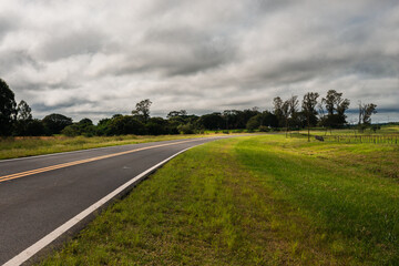 Landscape with road and cloudy sky
