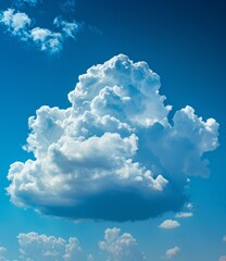 Large white cloud with a blue sky background - obrazy, fototapety, plakaty