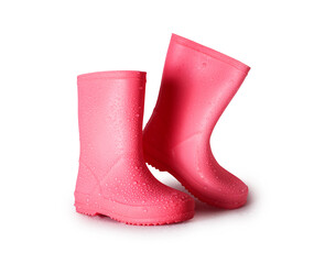 Stylish pink rubber boots with raindrops on the surface isolated on a white background