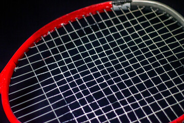 Big red tennis racket close up