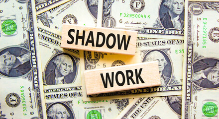 Shadow work psychology symbol. Concept words Shadow work on beautiful wooden blocks. Dollar bills....