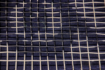 Nylon strings of a tennis racket close-up