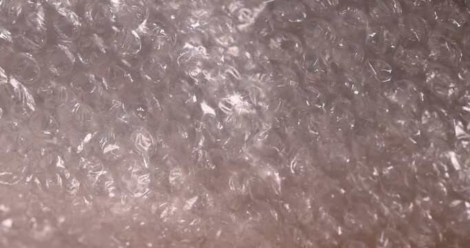old air cellophane with a lot of bubbles for safe storage of things, close-up of a protective film with air bubbles