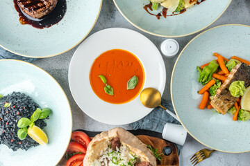 Table Full of Food: An image capturing a bountiful spread of various dishes arranged on a table, showcasing a diverse assortment of cuisines and flavors, ideal for feasts or banquets.