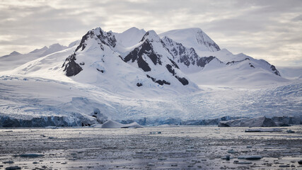 Towering Glacier Covered Mountains in Antarctica