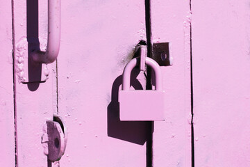 Grunge garage door. Rusty padlock texture. Metal entrance. Old peeling paint gate. Aged car garage...