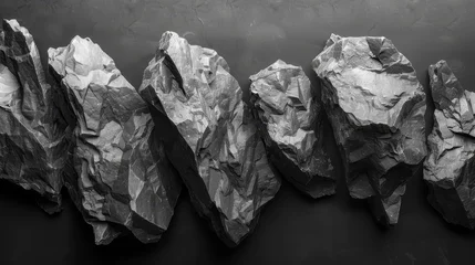 Fotobehang   A single black-and-white image of rocks against a uniform black background, repeated four times © Nadia