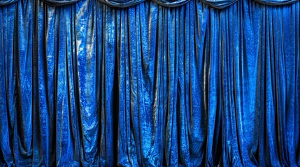   A detailed view of a blue curtain with a metal pole centrally positioned through it - obrazy, fototapety, plakaty