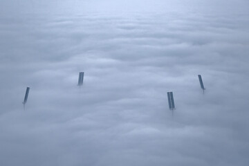 Qatar Sports Club Suheim bin hamad  football stadium during fog. flood lights poles