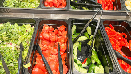 Swedish table in hotel, salad bar, delicious vegetables without limits. fresh tomatoes, peppers,...