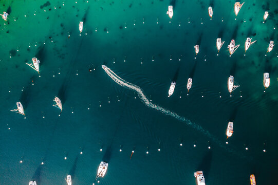 Aerial Image of Boat Riding Through Marina